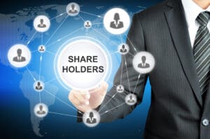 Businessman pointing at shareholders network concept.