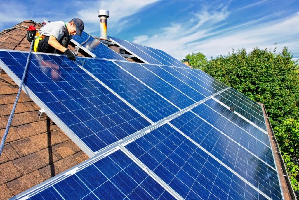 Solar panels being installed on a house