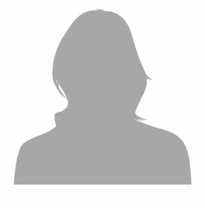 Silhouette of a person with shoulder-length hair against a plain background.