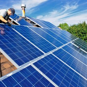 Solar panels being installed on a house