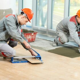 Two Construction worker working on flooring